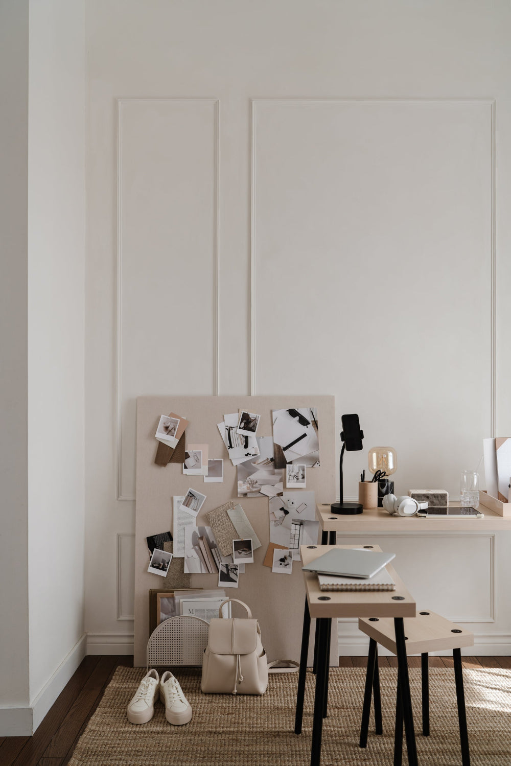 printing studio with a board of pinned photo prints